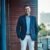 Portrait of a confident businessman standing on an office balcony